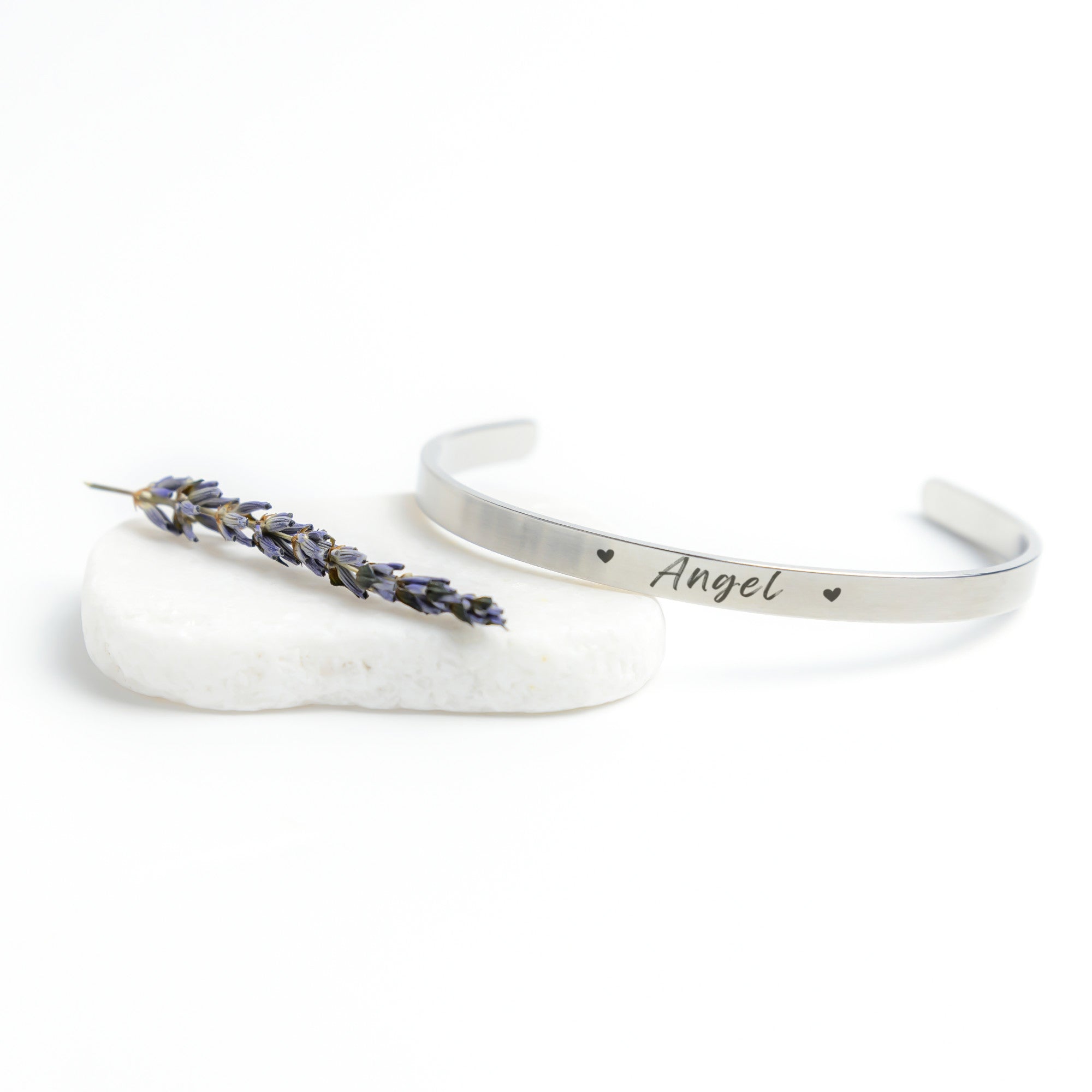 Silver Cuff Bracelet with the word "Angel" engraved in the front.  The inside reads, "I love you to the moon and back."