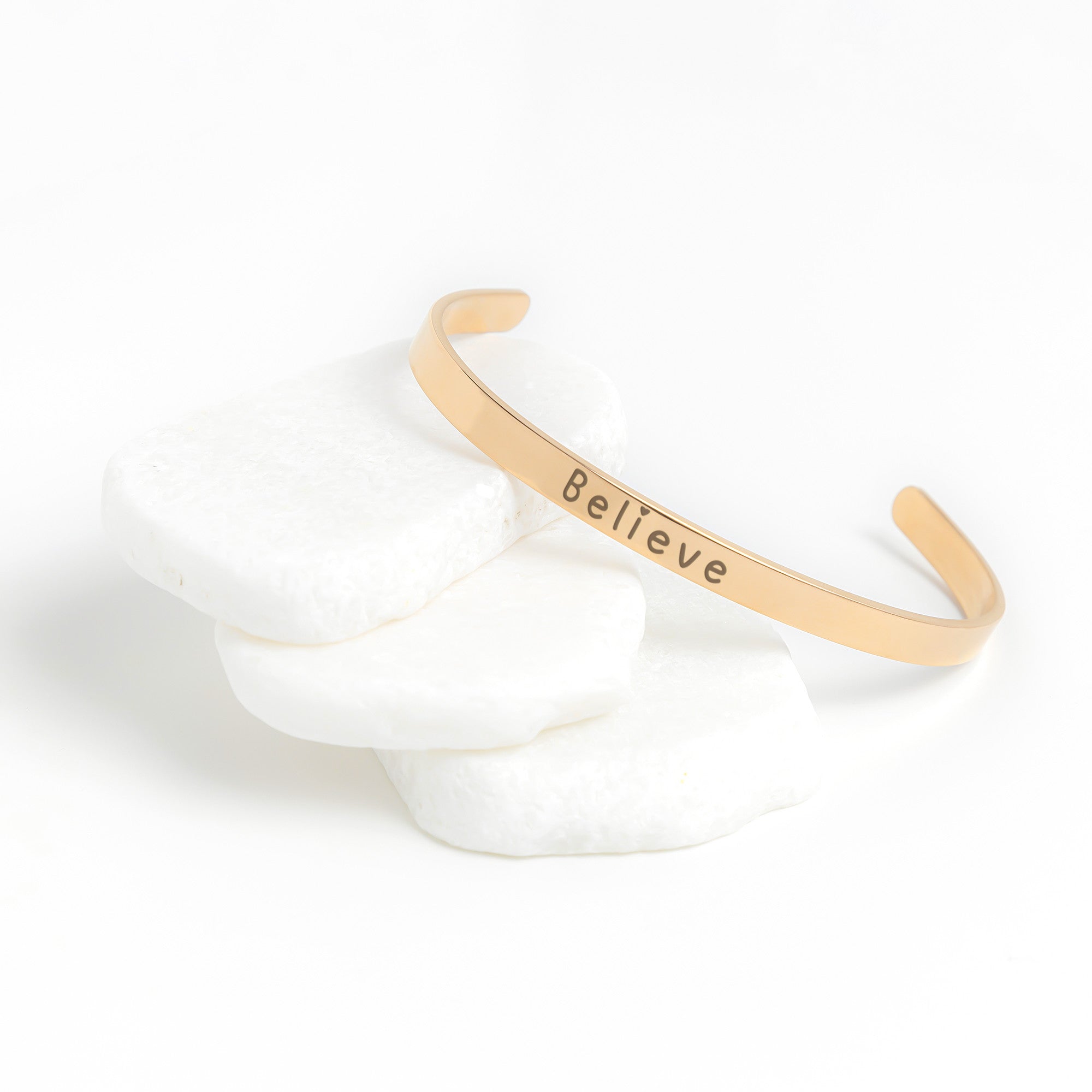 Silver Cuff Bracelet with the word "Believe" written on the outside. The inside reads, "Believe in the beauty of your journey.